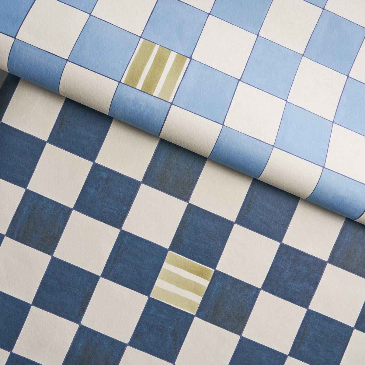 Rolled blue-and-white checker fabric with navy and sky blue squares, white gaps, and subtle gold stripe accents.