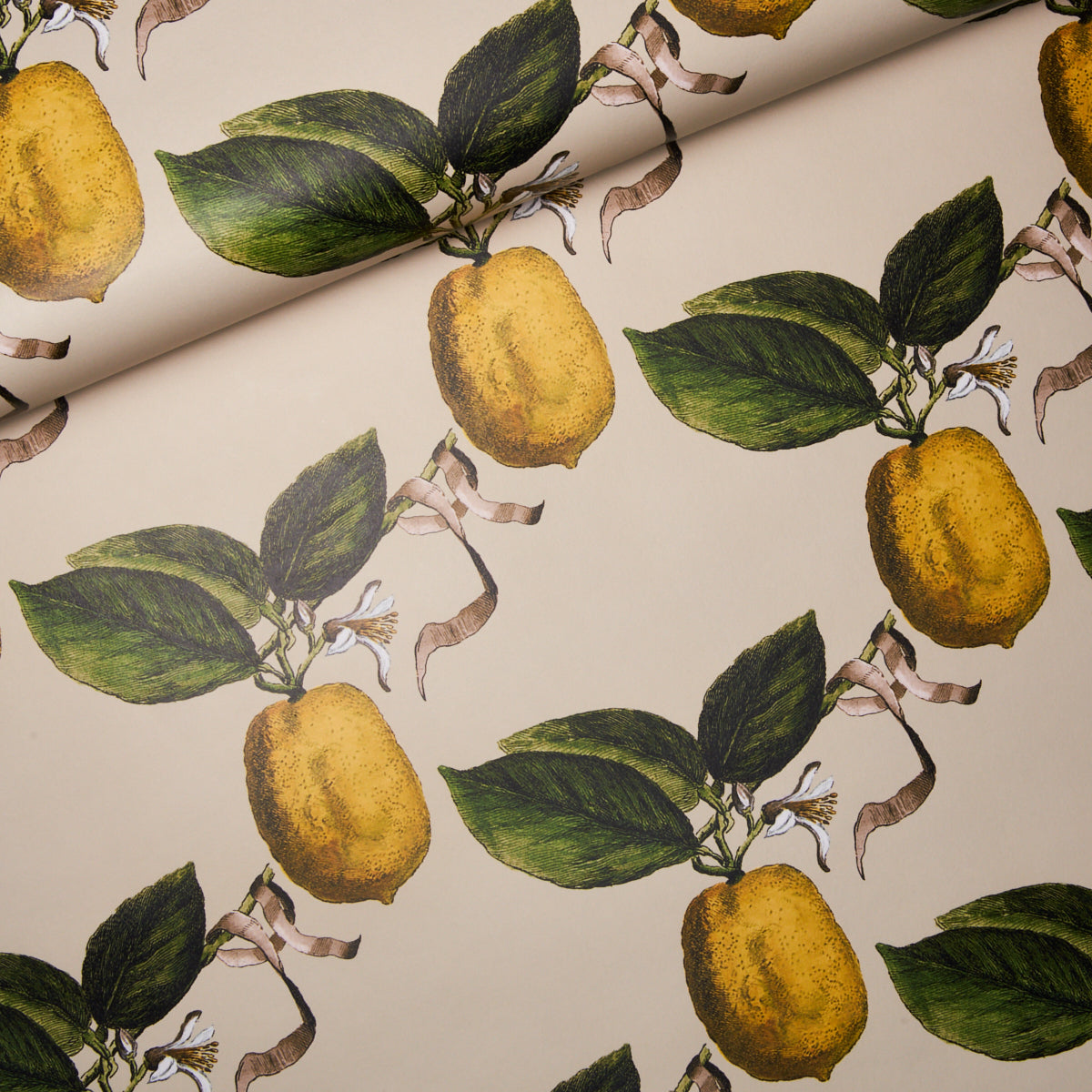 Beige fabric pattern with yellow lemons, green leaves and twisting brown vines; fresh, vintage botanical print.