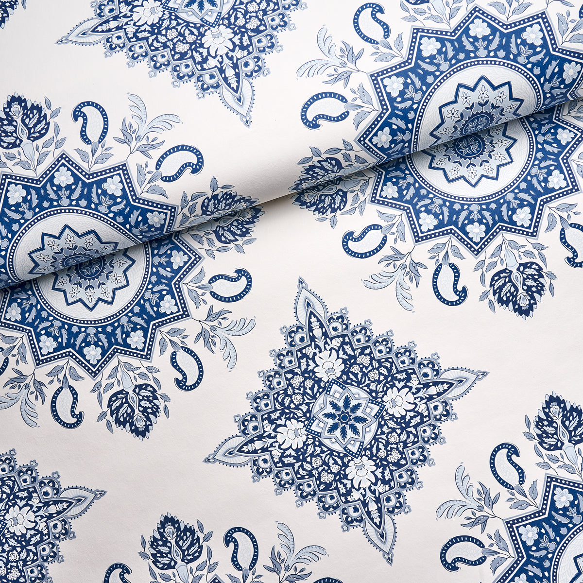 Indigo and white mandala medallion print fabric with repeating floral motifs; boho textile for sewing or decor