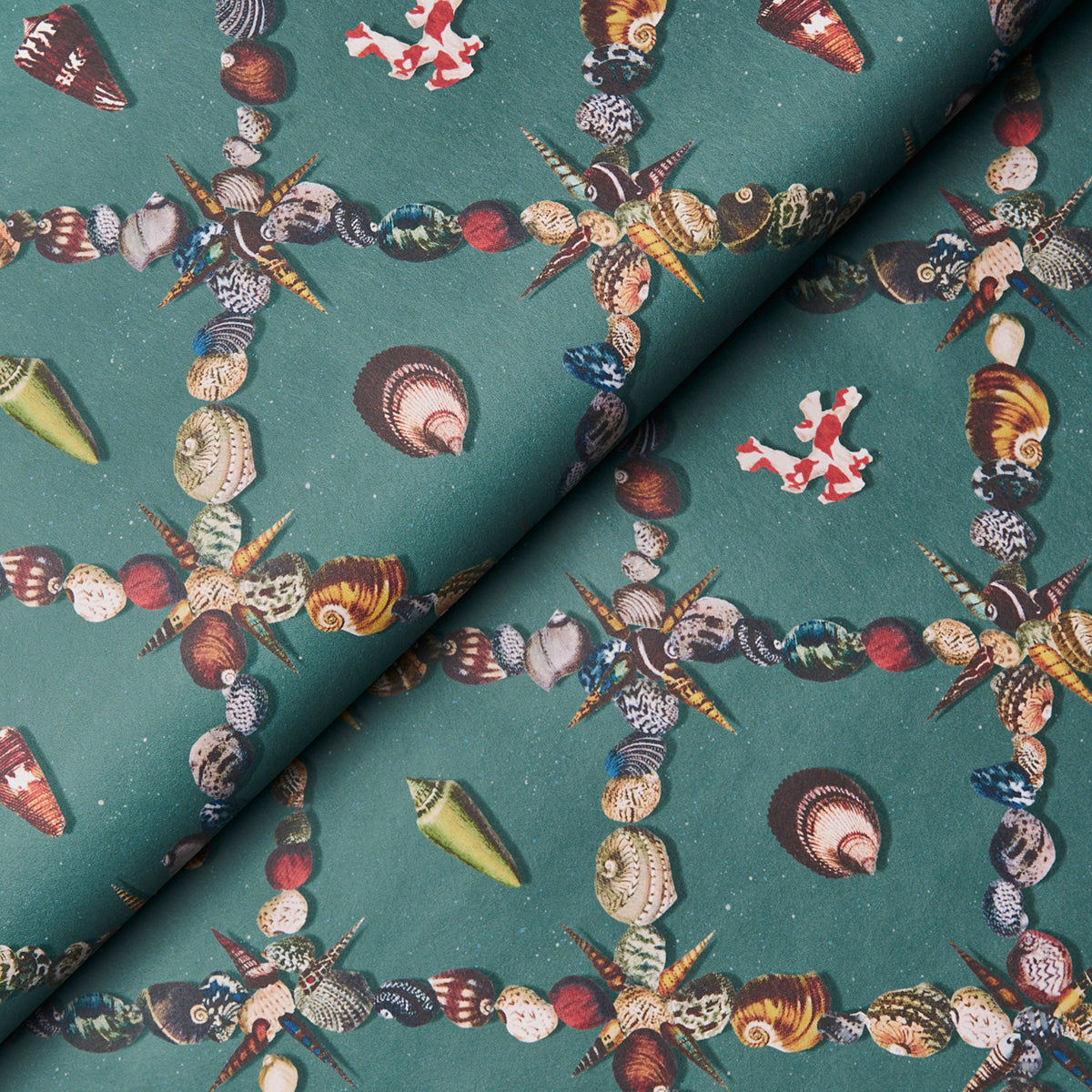 Teal fabric with a repeating chain of multicolored seashells and starfish, nautical print.