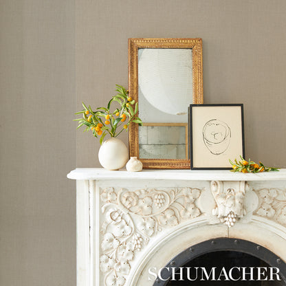 Linen wallcovering swatch in flax color with subtle fabric texture