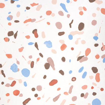 Terrazzo-like pattern on white background with irregular peach, coral, light blue, brown and beige specks.