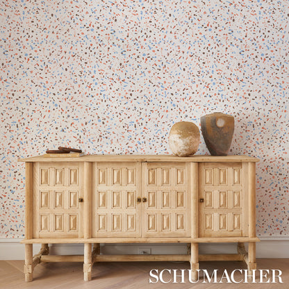 Light-toned terrazzo-patterned backdrop.