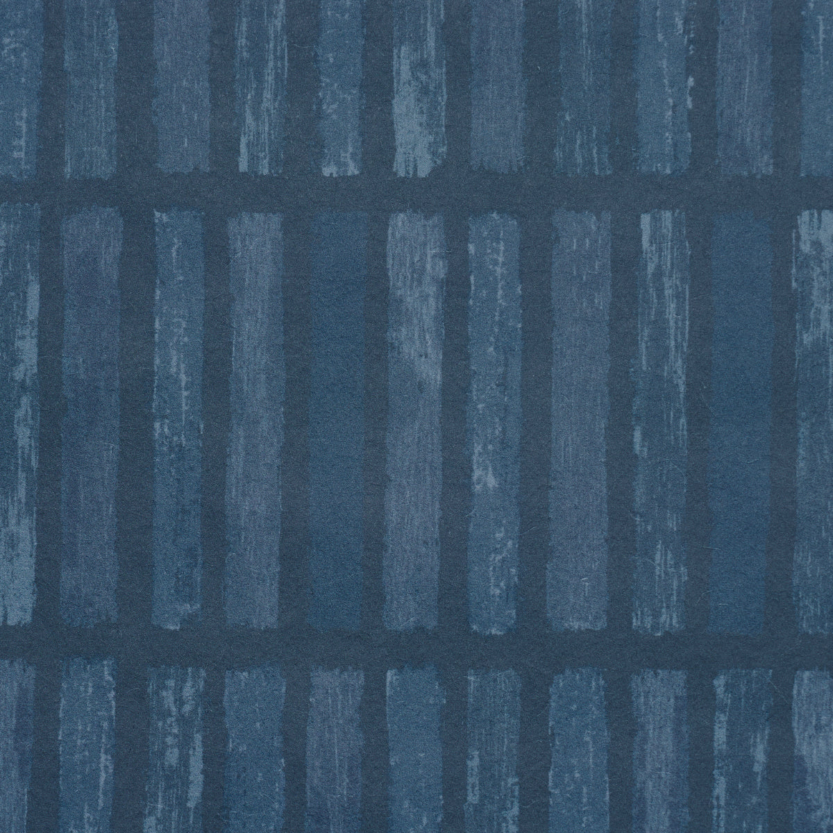Navy blue textile pattern with vertical light-blue brushed bars forming a subtle grid.