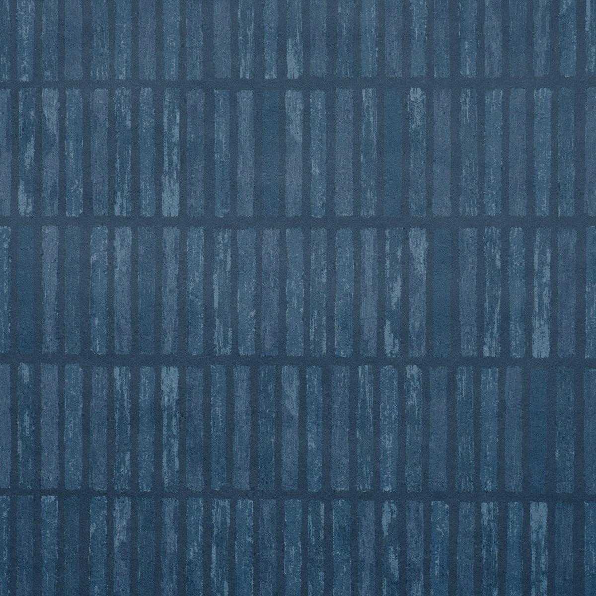 Dark blue textured wallpaper with vertical light-blue brushstroke stripes arranged in a grid pattern.