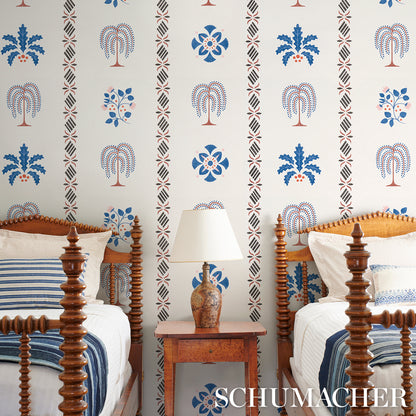 Blue stencil wallpaper in a vintage bedroom setting.