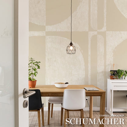 Wood dining table with white and black chairs, geometric pendant light, abstract wall art, potted plants and white console.