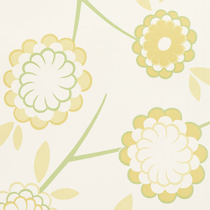 Beige wallpaper with pale yellow-green floral blooms, layered petals on curling green stems.