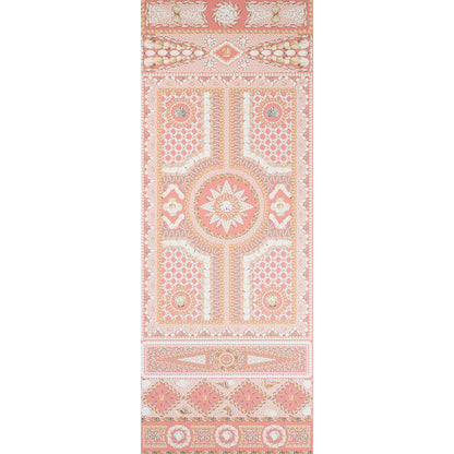 Soft coral and beige ornate wallpaper panel with a central sunburst medallion, geometric panels, and decorative borders.