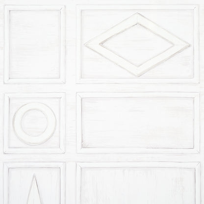 White paneled cabinet door with raised rectangular panels; diamond inset top-right and circular inset middle-left; distressed finish.