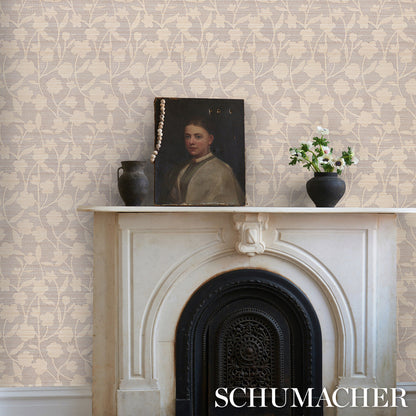 Beige floral wallpaper, white marble mantel with ornate arch and black surround; vintage portrait, pearl necklace, dark vase.