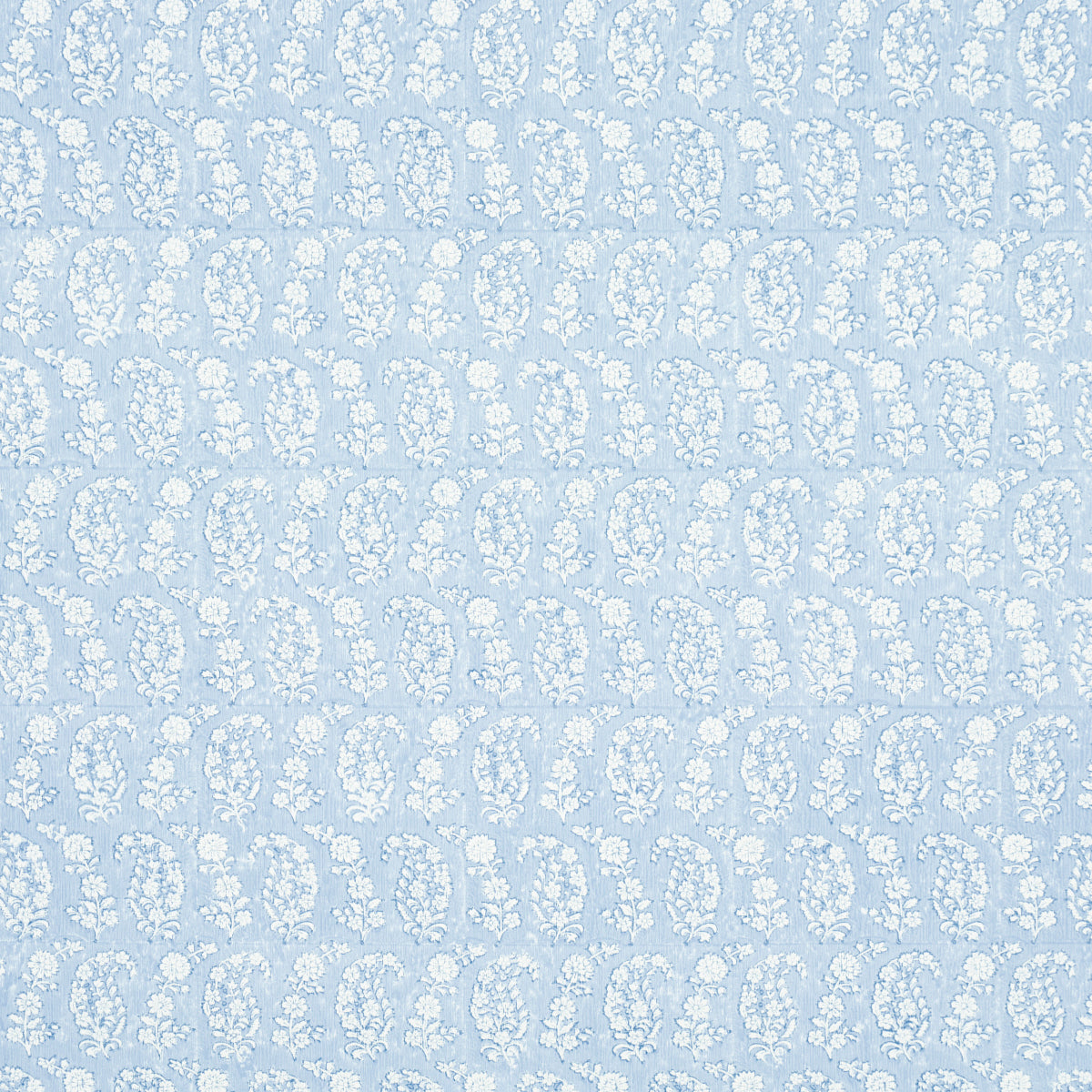 Pale blue fabric with a repeating white floral damask pattern.