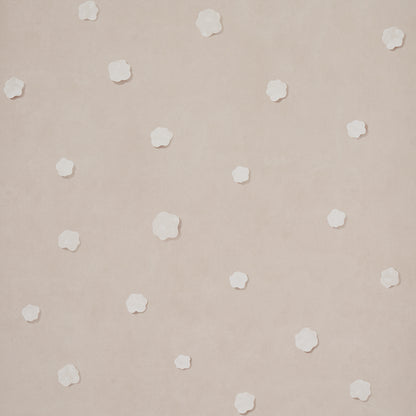 Beige-pink wallpaper with small white five-petal flowers scattered across.