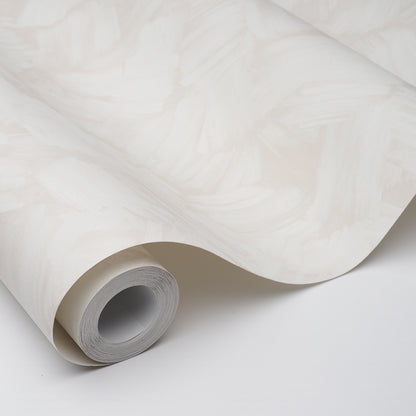 Cream beige marbled wallpaper roll with subtle swirls, rolled edge showing inner cardboard tube.