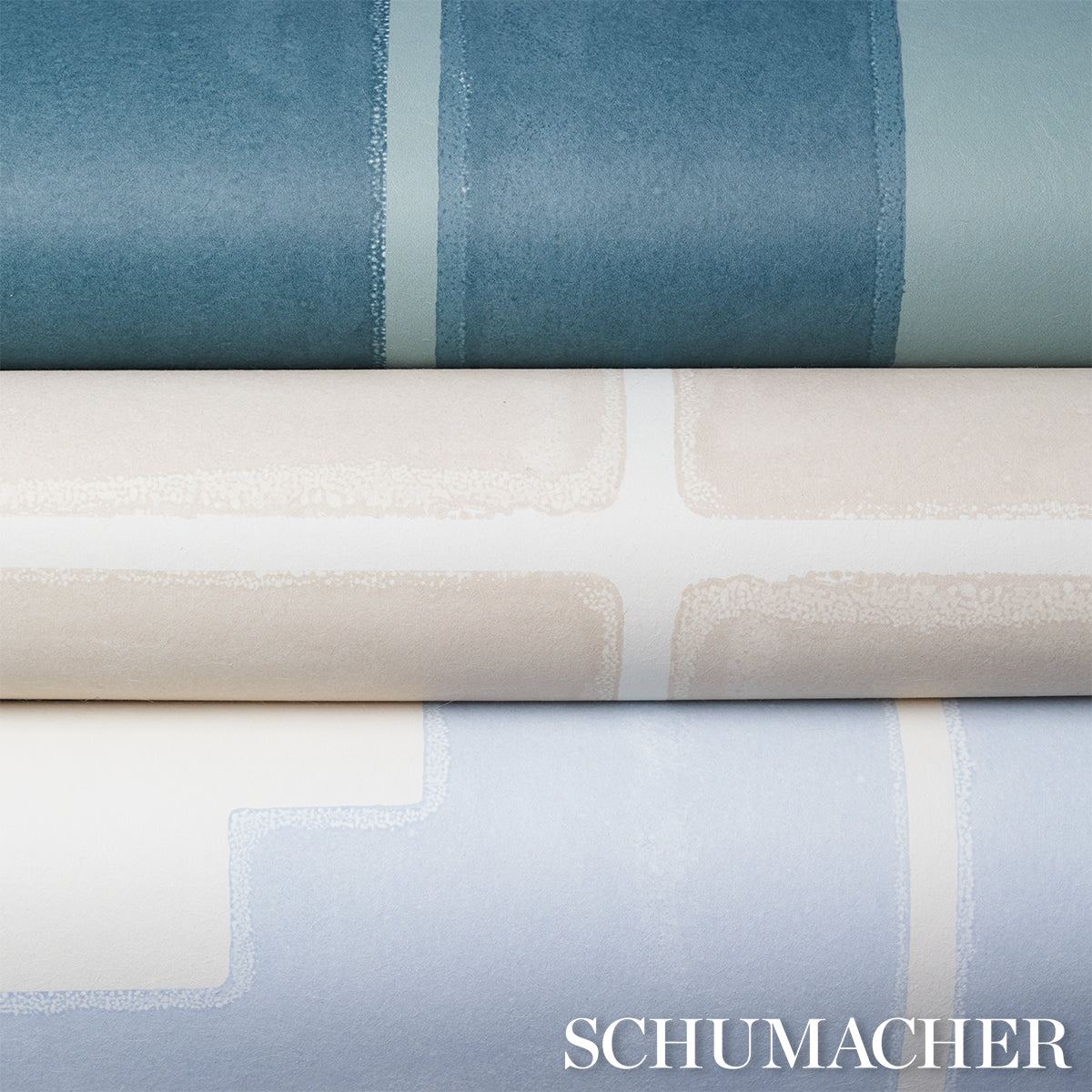 Rolled wallpaper samples in teal with white grout lines.