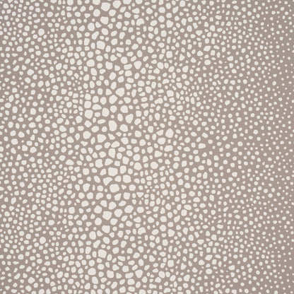 Taupe-beige background with irregular ivory pebble dots forming a speckled, organic pattern