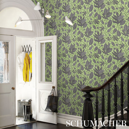 Green botanical wallpaper with dark leaves.