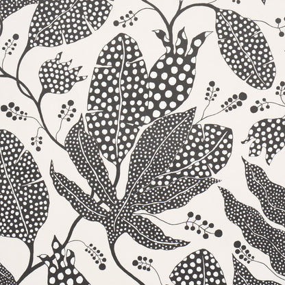 Black botanical leaf print with dotted fills on cream background; versatile fabric or wallpaper pattern.