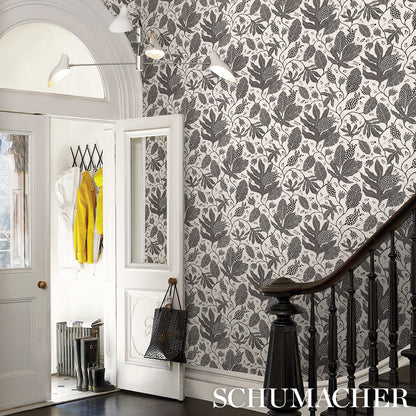 Black and cream wallpaper with a bold dotted pattern.