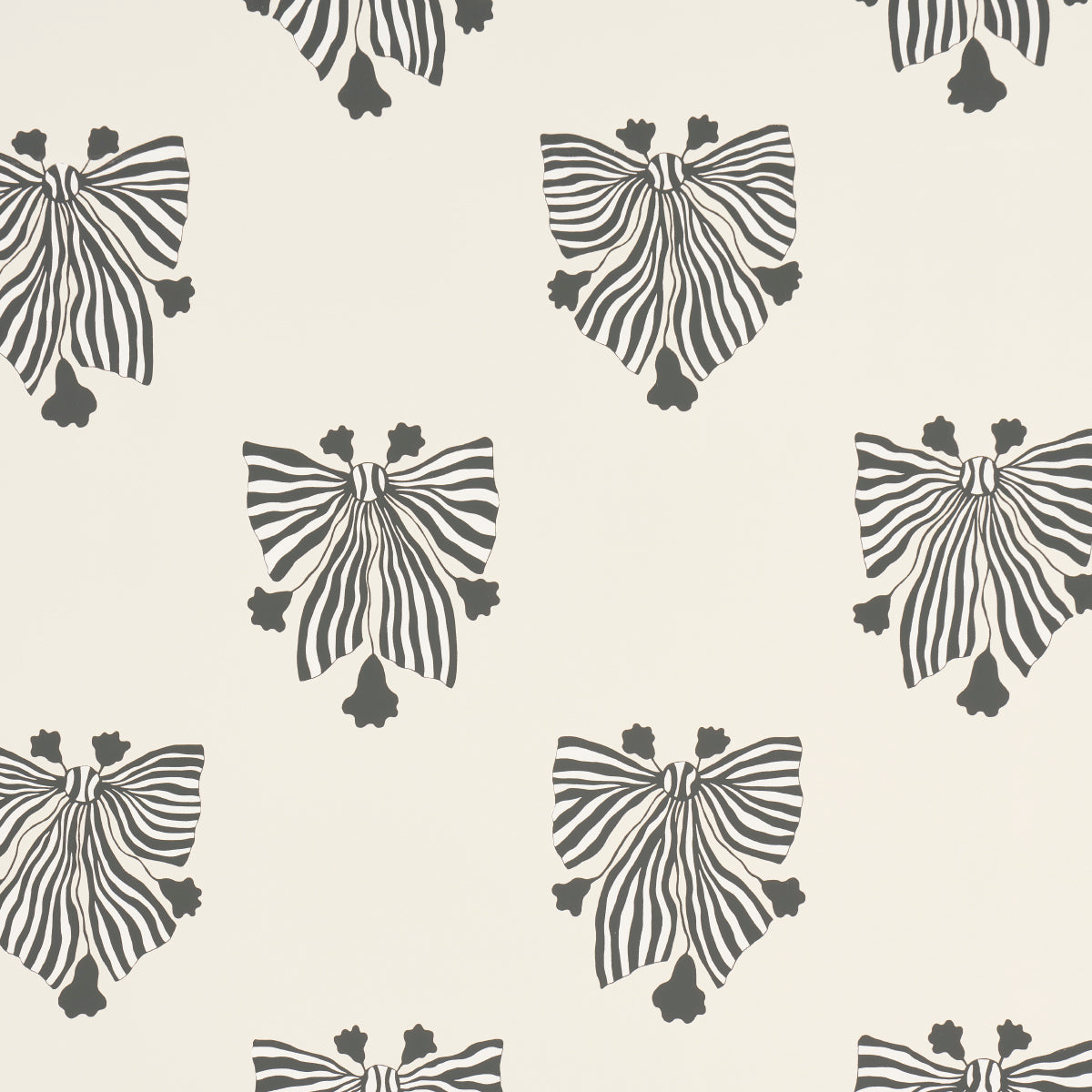Cream wallpaper with repeating black striped bow motifs, ribbon-inspired decorative pattern.