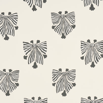 Cream wallpaper with repeating black striped bow motifs, ribbon-inspired decorative pattern.
