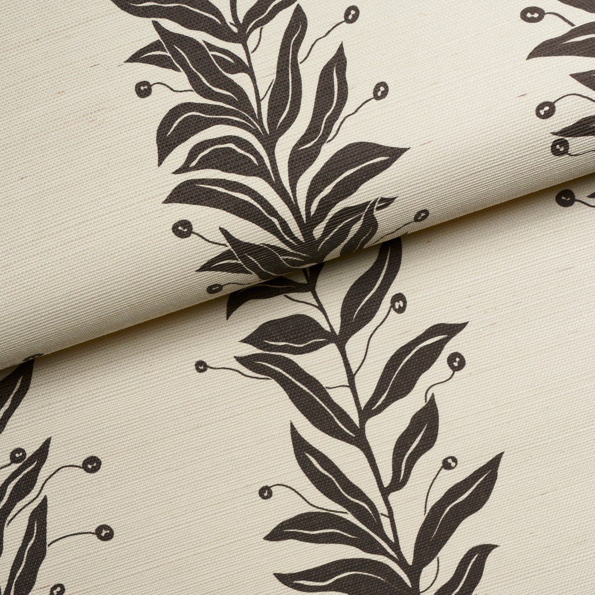 Beige sisal fabric swatch with a tendril stripe pattern in black and cream, folded edge.