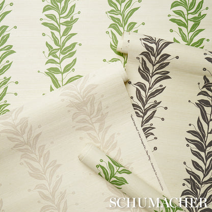 Tendril stripe wallpaper on a sisal texture in black & cream, rolled and unfurled swatches.