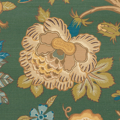 Green fabric with a large cream-gold flower and yellow-green leaves in a vintage floral pattern.
