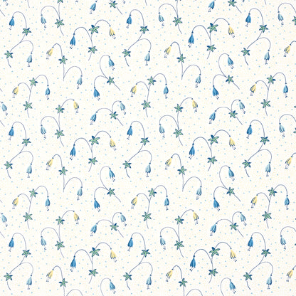 Cream fabric with delicate watercolor blue and yellow floral sprigs on curved stems and green leaves in a repeating print.