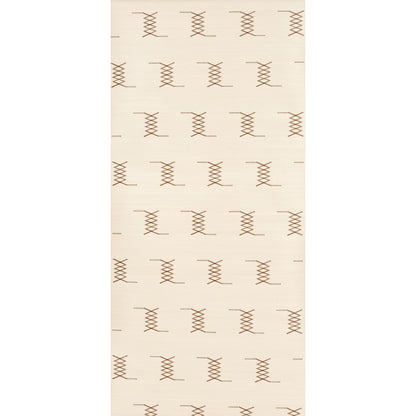 Beige rectangular rug with repeating brown X-shaped stitch motifs across the surface.