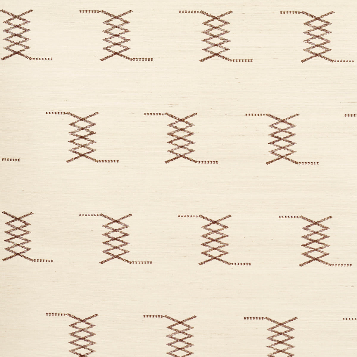 Cream-beige fabric with repeating brown cross-stitch lattice motifs; rustic geometric textile for upholstery.