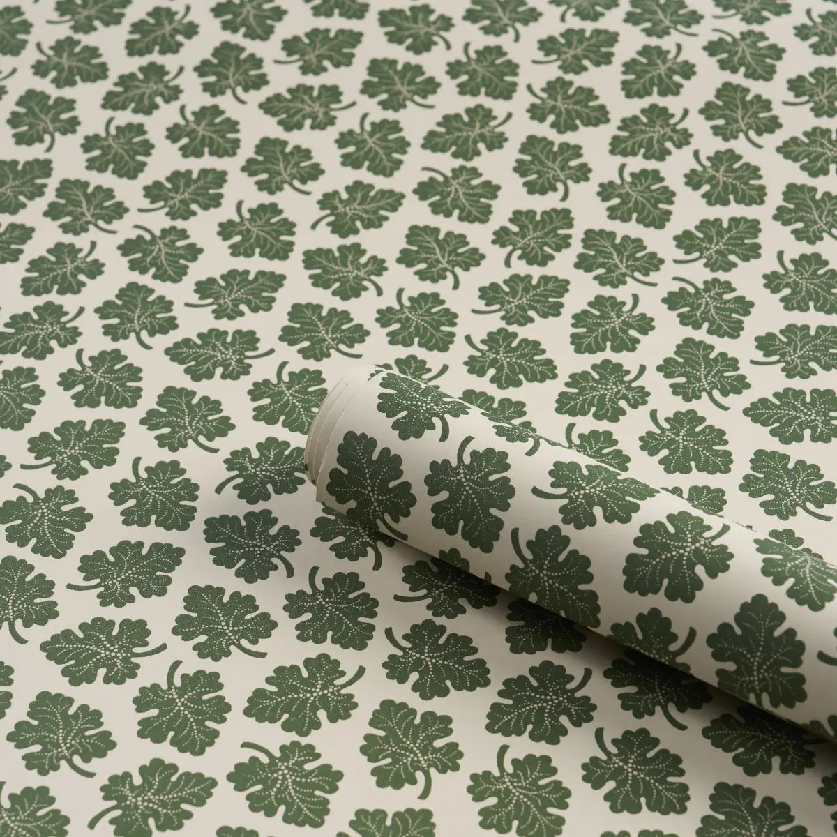 Rita Konig Olive Wallpaper in Green featuring a small-scale multidirectional botanical leaf pattern inspired by 18th-century wallpaper designs. This luxury Schumacher wallpaper showcases delicate gravure-printed olive leaves on a smooth non-woven paper ground, creating a refined and timeless look. Ideal for living rooms, bedrooms, dining rooms, hallways, powder rooms, cottage homes, English country interiors, traditional decorating styles, transitional spaces, and elegant residential projects.