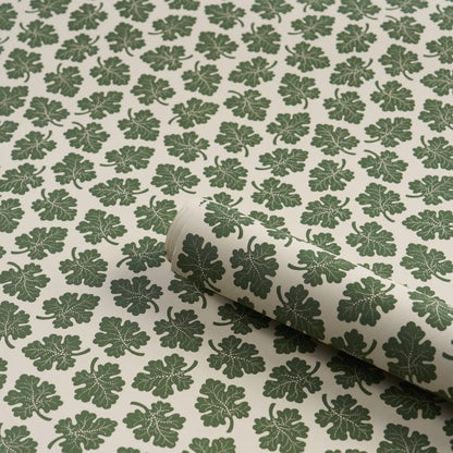 Rita Konig Olive Wallpaper in Green featuring a small-scale multidirectional botanical leaf pattern inspired by 18th-century wallpaper designs. This luxury Schumacher wallpaper showcases delicate gravure-printed olive leaves on a smooth non-woven paper ground, creating a refined and timeless look. Ideal for living rooms, bedrooms, dining rooms, hallways, powder rooms, cottage homes, English country interiors, traditional decorating styles, transitional spaces, and elegant residential projects.