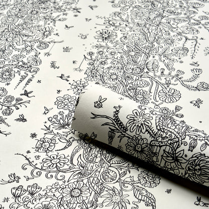 White wallpaper with dense black botanical line art of flowers and vines; rolled corner shows pattern.