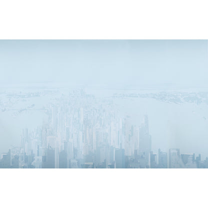 Blue-toned aerial view of a modern city skyline with tall glass skyscrapers fading into haze.