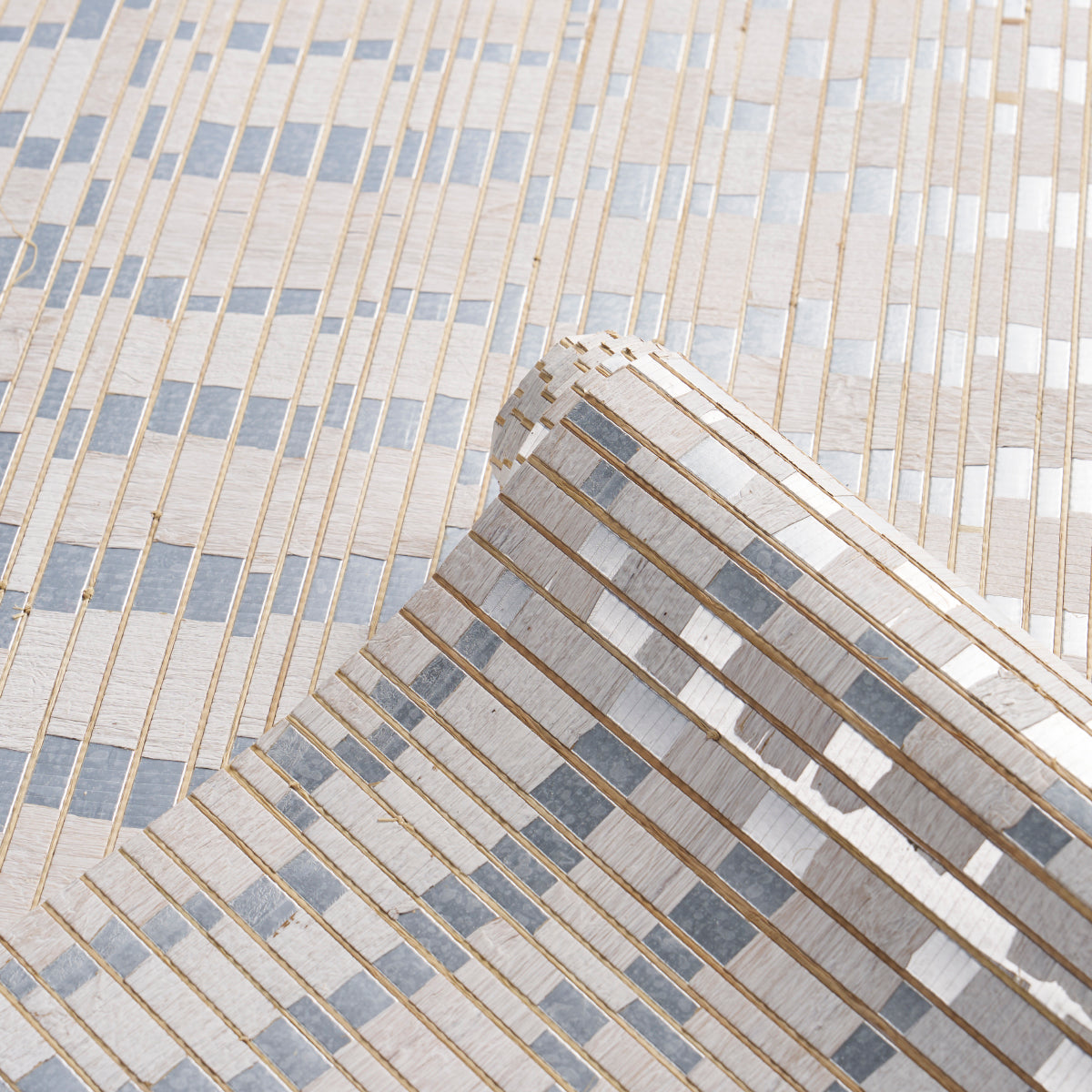 Close-up of a textured silver waterlily wallcovering pattern with a metallic finish.