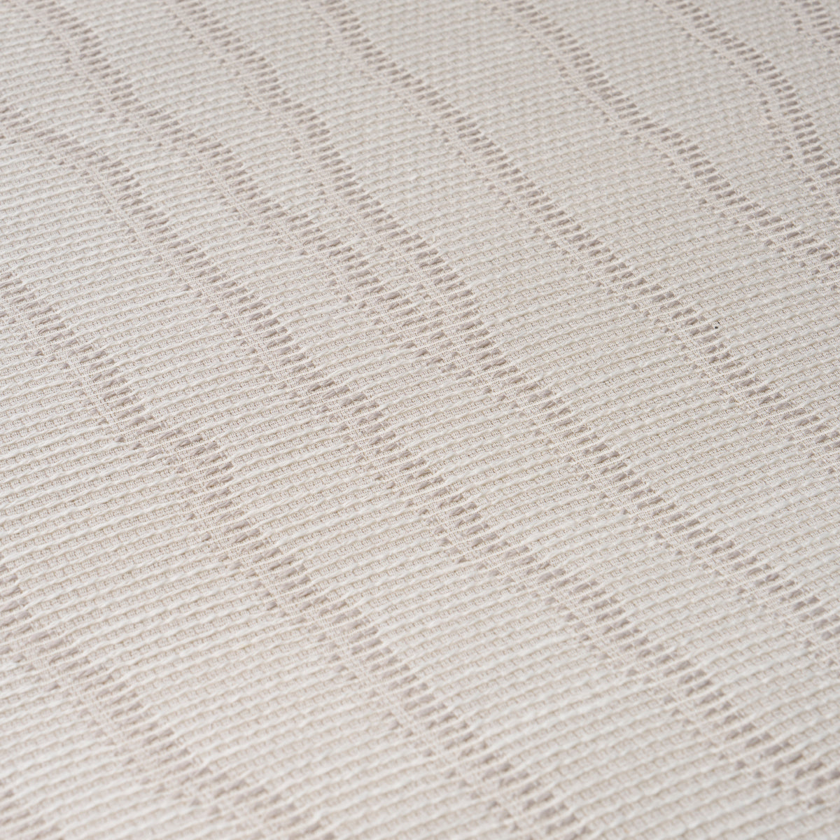 Soft fog wallcovering with a subtle wavy pattern and textured weave.
