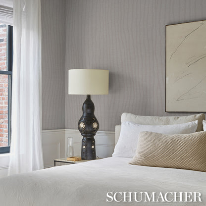 Gray patterned wallcovering with a subtle textured design.