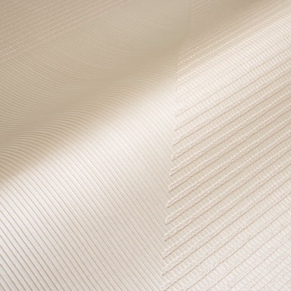 Cream-beige wallcovering with a pearlescent, textured woven finish and a hand-combed triangular pattern.