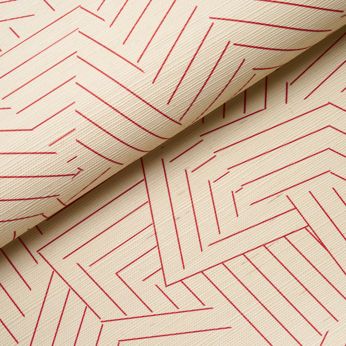 Cream textured wallcovering with a woven sisal texture and red deconstructed stripe pattern, folded to reveal a layered design.
