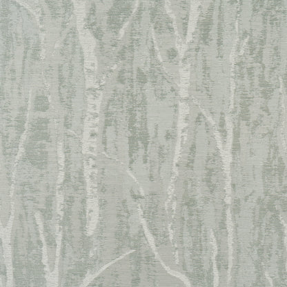 Soft sage-green and ivory birch-tree patterned rug with textured weave; woodland motif for living room decor.