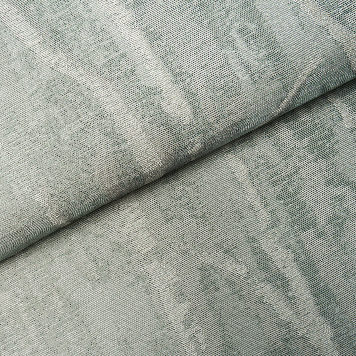 Sage green jacquard damask wallcovering with subtle woven pattern, folded.