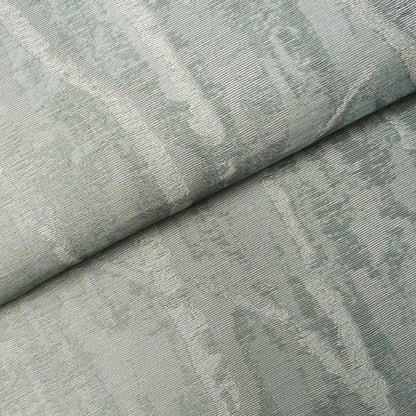 Sage green jacquard damask wallcovering with subtle woven pattern, folded.