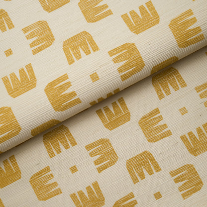 Cream fabric with mustard yellow M-shaped geometric print, rolled textile for upholstery or crafts.