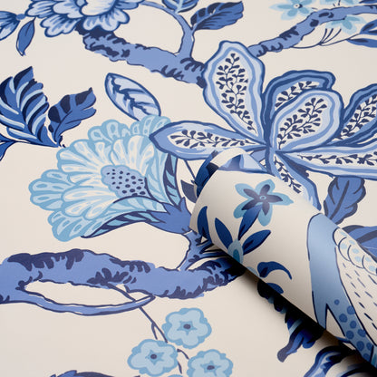 Blue and light-blue floral wallpaper on white; features large blossoms and leaves; rolled edge.