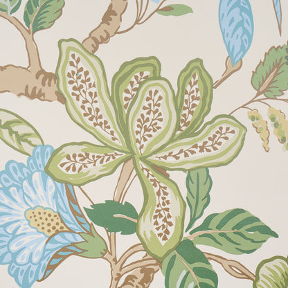 Pastel botanical wallpaper with large green and brown leaf clusters and blue floral accents on beige background.