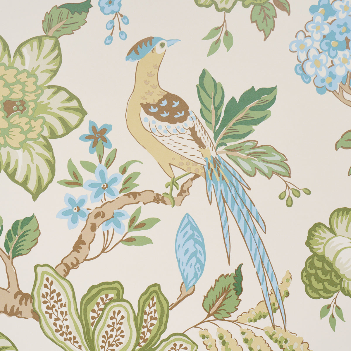 Decorative wallpaper with a long-tailed bird perched on branches amid blue flowers and green foliage on a beige background.