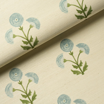 Closeƒ??up of Schumacher Saranda Flower Sisal wallpaper (SKU 5016671) showing textured paper-backed sisal fibers and stylized floral motifs in soft sky tones ƒ?? perfect for feature walls, accent wallpapers, and high-end interiors