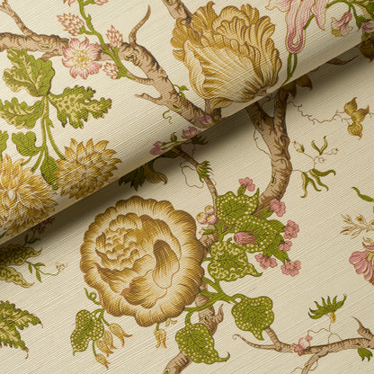 Beige botanical wallpaper with antique gold blooms, green leaves, and pink accents; rolled corner.