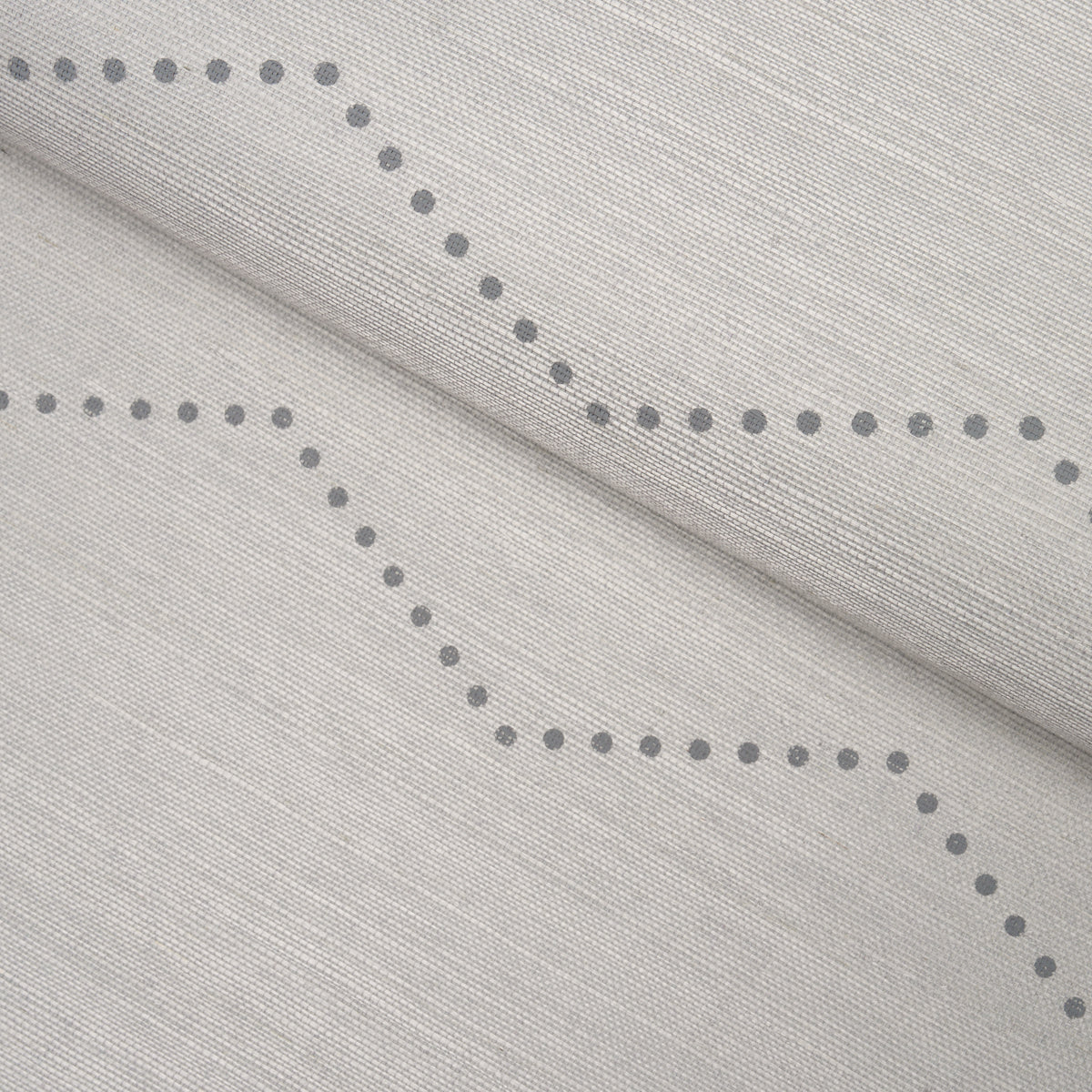 Light gray textured fabric with dotted curved line motif, ideal for curtains or upholstery.
